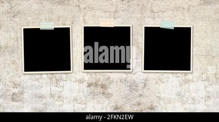 Three retro photos on old stucco wall. Vintage blank photo frames. Mock up template. Copy space for your text Stock Photo