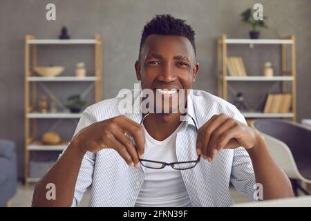 Portrait of young cheerful african american man smiling looking at camera Stock Photo