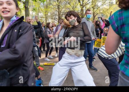 Dancing to music at an outdoors sound system, female. May 1st, 2021. Vauxhall Pleasure Gardens, London, UK