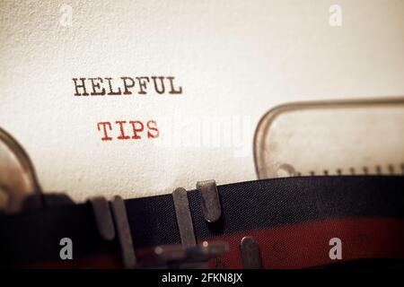 Helpful tips phrase written with a typewriter. Stock Photo