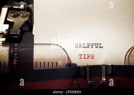 Helpful tips phrase written with a typewriter. Stock Photo