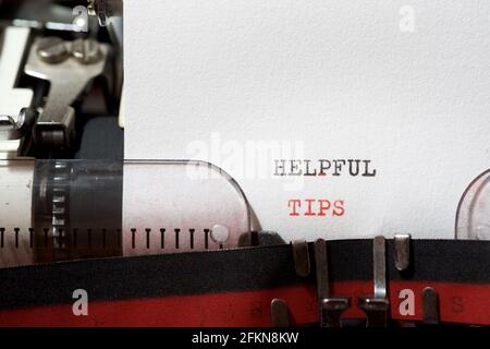 Helpful tips phrase written with a typewriter. Stock Photo