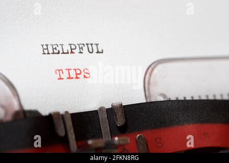 Helpful tips phrase written with a typewriter. Stock Photo