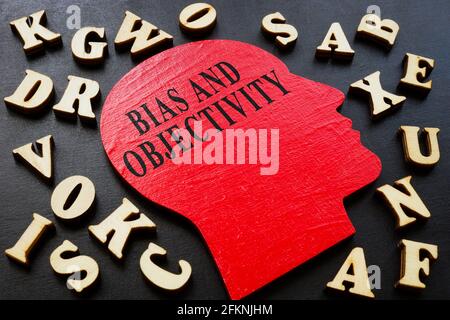 Words bias and objectivity on the head shape and letters. Stock Photo