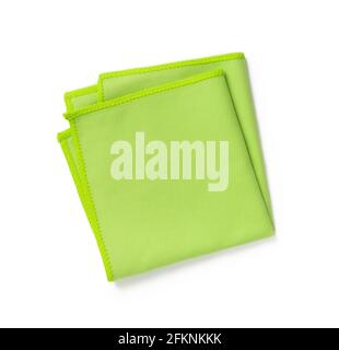 Green microfiber cloth folded in four isolated on white background. New microfiber soft material for cleaning objects and surfaces. Рousehold choresю Stock Photo