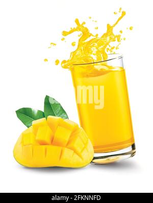 Mango juice splash out of glass with mango fruit on white background Stock Photo