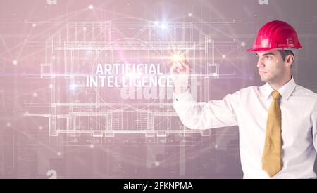 Handsome architect drawing with helmet Stock Photo