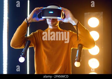 Young gamer using virtual reality headset Stock Photo