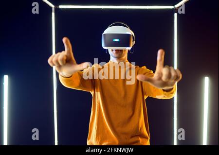 Gamer using virtual reality headset, front view Stock Photo