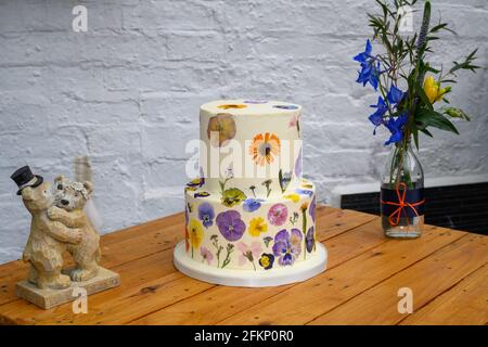 Wedding cake with pressed flower design Stock Photo
