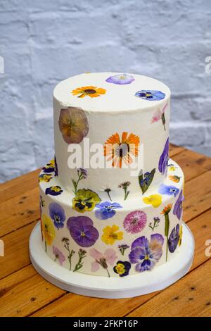 Wedding cake with pressed flower design Stock Photo