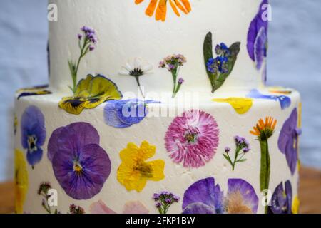 Wedding cake with pressed flower design Stock Photo