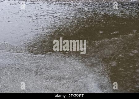 Frozen ice surface abstract background, river in winter. Stock Photo