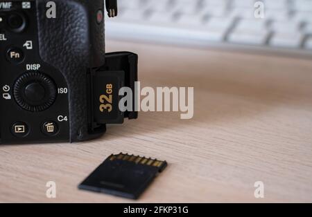 camera with 2 sd cards on table Stock Photo