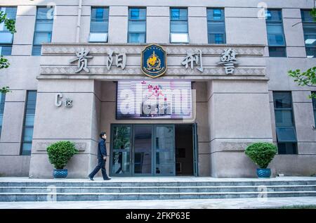 (210503) -- GUIYANG, May 3, 2021 (Xinhua) -- Zhu Yunhong is about to enter the office building of the criminal detective division of the Guiyang Public Security Bureau in Guiyang, southwest China's Guizhou Province, May 2, 2021. Zhu Yunhong is a police profile artist with 16 years of experience working at the criminal detective division of the Guiyang Public Security Bureau. Pencil in hand, he has helped crack down on quite a few cases of significant impact. 'I am not drawing, but retrieving people's memory,' said Zhu, 'Manually profiling is needed to fill in gap when no surveillance camera Stock Photo