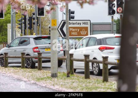 Brierley Hill, West Midlands, UK. 3rd May, 2021. Traffic queues at the entrance to Merry Hill shopping centre, Brierley Hill in the West Midlands, as wet and windy weather encourages people to go shopping instead of out walking and enjoying the Bank Holiday Monday. Peter Lopeman/Alamy Live News Stock Photo