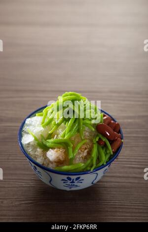 Malaysian desserts called Cendol .Cendol is made from crushed ice cubes and a variety of sweets and fruits. Stock Photo