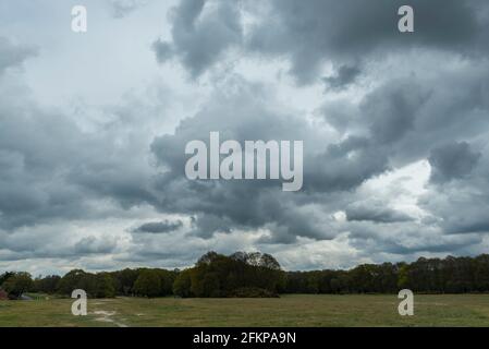 Chorleywood, UK.  3 May 2021.  UK Weather: Ominous grey clouds gather over Chorleywood Common, Hertfordshire on May’s early Bank Holiday Monday.  The forecast is for conditions to worsen with heavy rain and strong winds towards the end of the day.  Credit: Stephen Chung / Alamy Live News Stock Photo
