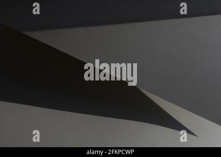 Shadow background. Grey paper texture. Abstract minimal composition. Stock Photo
