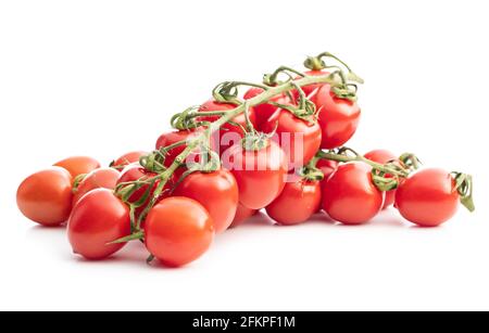 Fresh red cherry tomatoes. Small tomatoes on branch isolated on white background. Stock Photo