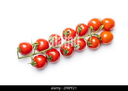 Fresh red cherry tomatoes. Small tomatoes on branch isolated on white background. Stock Photo