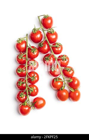Fresh red cherry tomatoes. Small tomatoes on branch isolated on white background. Stock Photo