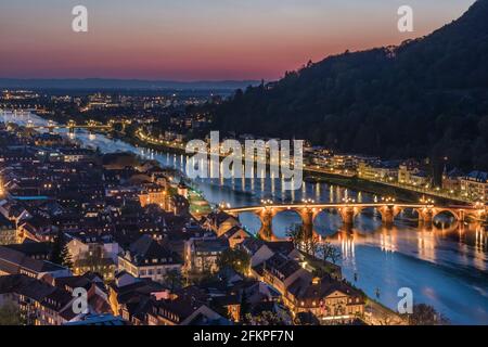 Heidelberg panorama with old city, old bridge and Neckar river after sunset. Beautiful illuminated. Stock Photo