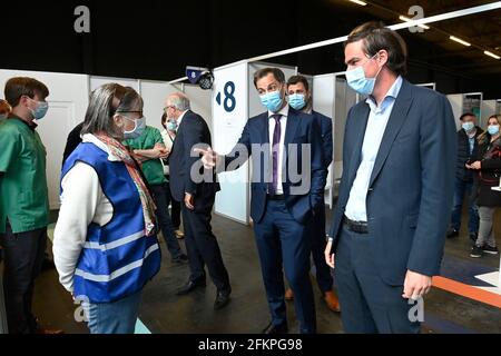 Prime Minister Alexander De Croo and Gent mayor Mathias De Clercq pictured during a visit to the the vaccination center at Flanders Expo in Gent, Mond Stock Photo