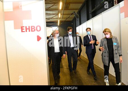 Gent mayor Mathias De Clercq (2L) and Prime Minister Alexander De Croo (2R) pictured during a visit to the the vaccination center at Flanders Expo in Stock Photo