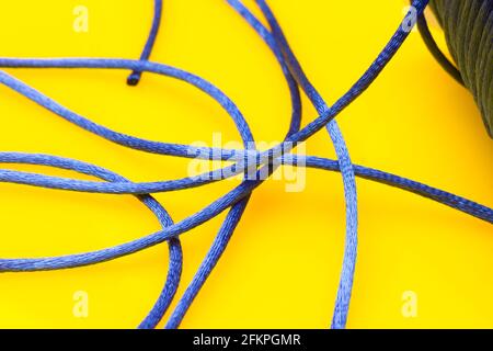 Ball with red yarn and thin rope isolated on white Stock Photo - Alamy