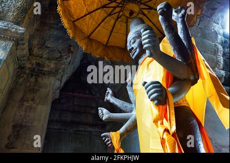Eight-armed statue of the Hindu God Shiva inside Angkor Wat, Siem Reap, Cambodia.