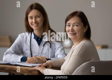 Portrait of happy senior female patient at meeting in clinic Stock Photo