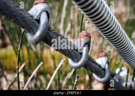 Suspension bridge metal tightening bolts in closeup Stock Photo