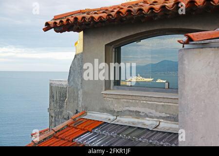 Sea view from the fourth floor of a house on the street of the Saint-Esprit in Antibes, Azure shore, France. Selective focus Stock Photo