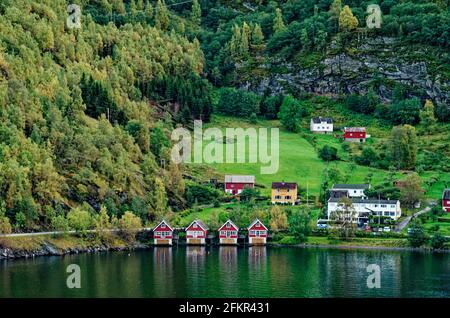 Scenic view to village at end of Aurlandsfjorden on west coast in early summer. Flam, Aurland, Norway, Scandinavia - Travel destination in North of Eu Stock Photo