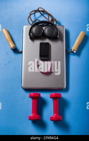 A positive person from objects. A man made of sports and electronic items. Vertical frame. Stock Photo