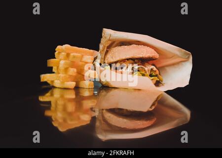 French fries falling into packaging Stock Photo by ©przemekklos 9353089