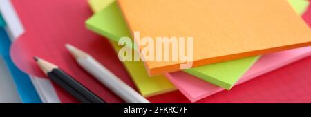 Colored white and black pencil stickers on folder Stock Photo