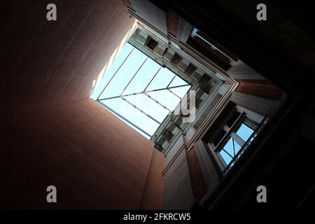 View looking up at skylight in brick facades and classical architecture, Prado Museum, Madrid, Spain Stock Photo