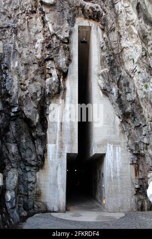 Slot entry carved in to solid rock to access fortified castle in Swiss Alps. Castlegrande, Bellinzona, Switzerland Stock Photo