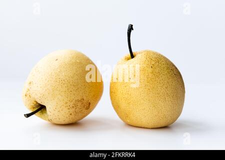 Two Asian pears isolated on a white. Stock Photo