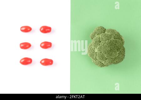 Creative layout made of cherry tomatoes and broccoli, flat lay, top view. Stock Photo