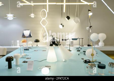 Blurred arrangement of hanging lighting fixtures, warm and vintage interior light, modern home decor, contemporary lamp design Stock Photo