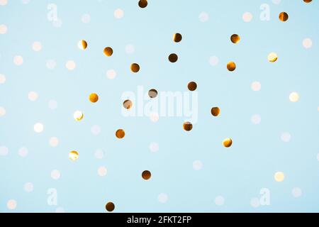 Festive light blue background with golden confetti Stock Photo