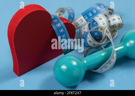 heart problems related to metabolic syndrome symbolized by the shape of the heart with a measuring tape Stock Photo