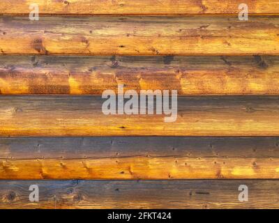 log cabin building wall exterior weatherproofed and varnished shiny Stock Photo