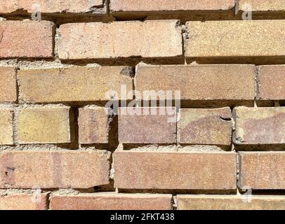 old decayed weathered old brick block garden building wall cracked and abandoned Stock Photo