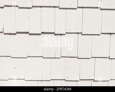 vintage retro wall siding shingles random sizes painted white Stock Photo