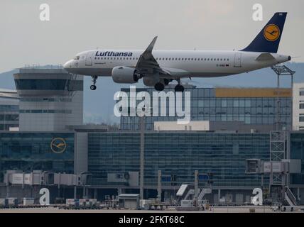 03 May 2021, Hessen, Frankfurt/Main: A Lufthansa Airbus A320neo passenger aircraft lands at Frankfurt Airport. On 04 May, the annual general meeting of the ailing airline takes place as a purely virtual event. The aviation industry is particularly hard hit by the effects of the global Corona pandemic. Photo: Boris Roessler/dpa Stock Photo