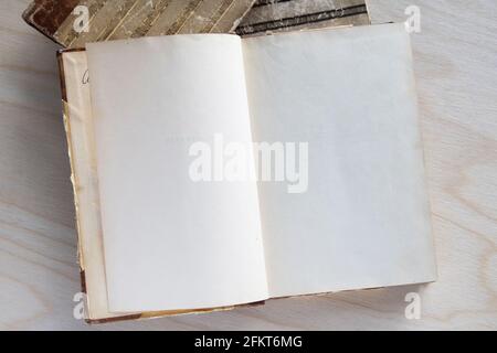 Old vintage book on wooden table. Open book with blank pages Stock Photo